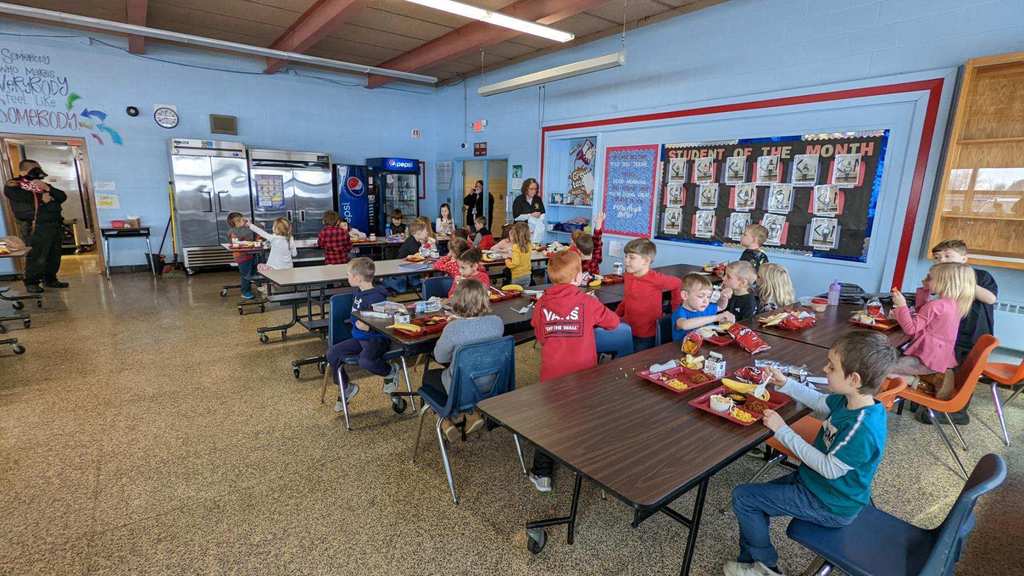 Cafeteria with students and visitors