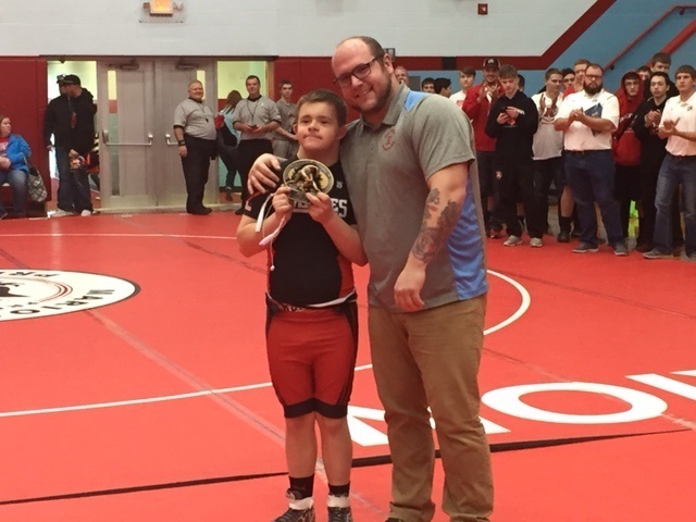 Most Outstanding Wrestler Ryan Drury, Cardington accepting the award from head Coach David Williams